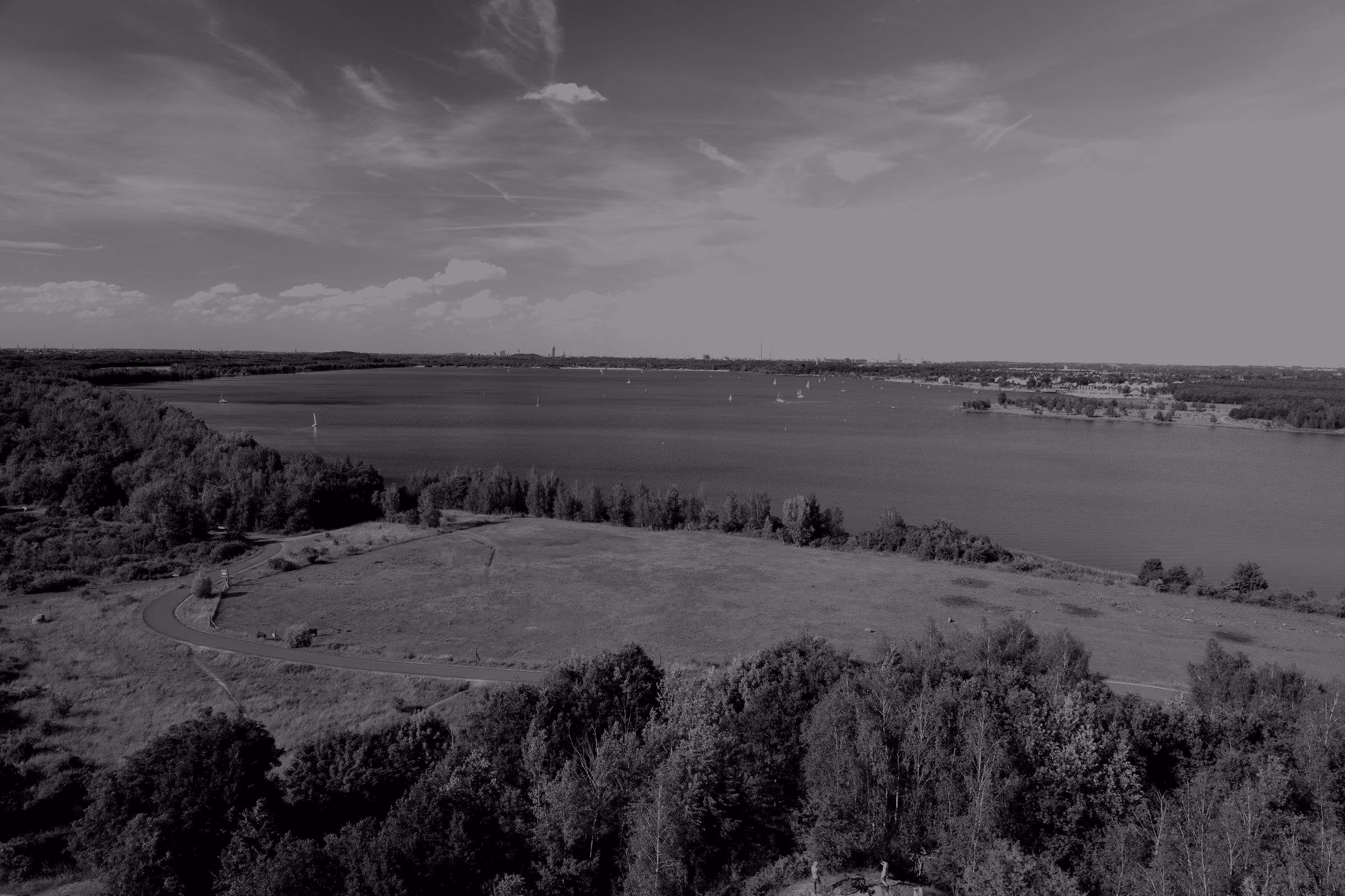 Lake Cospuden seen northwards from the Bistumshöhe observation tower, with Leipzig city centre in the background.