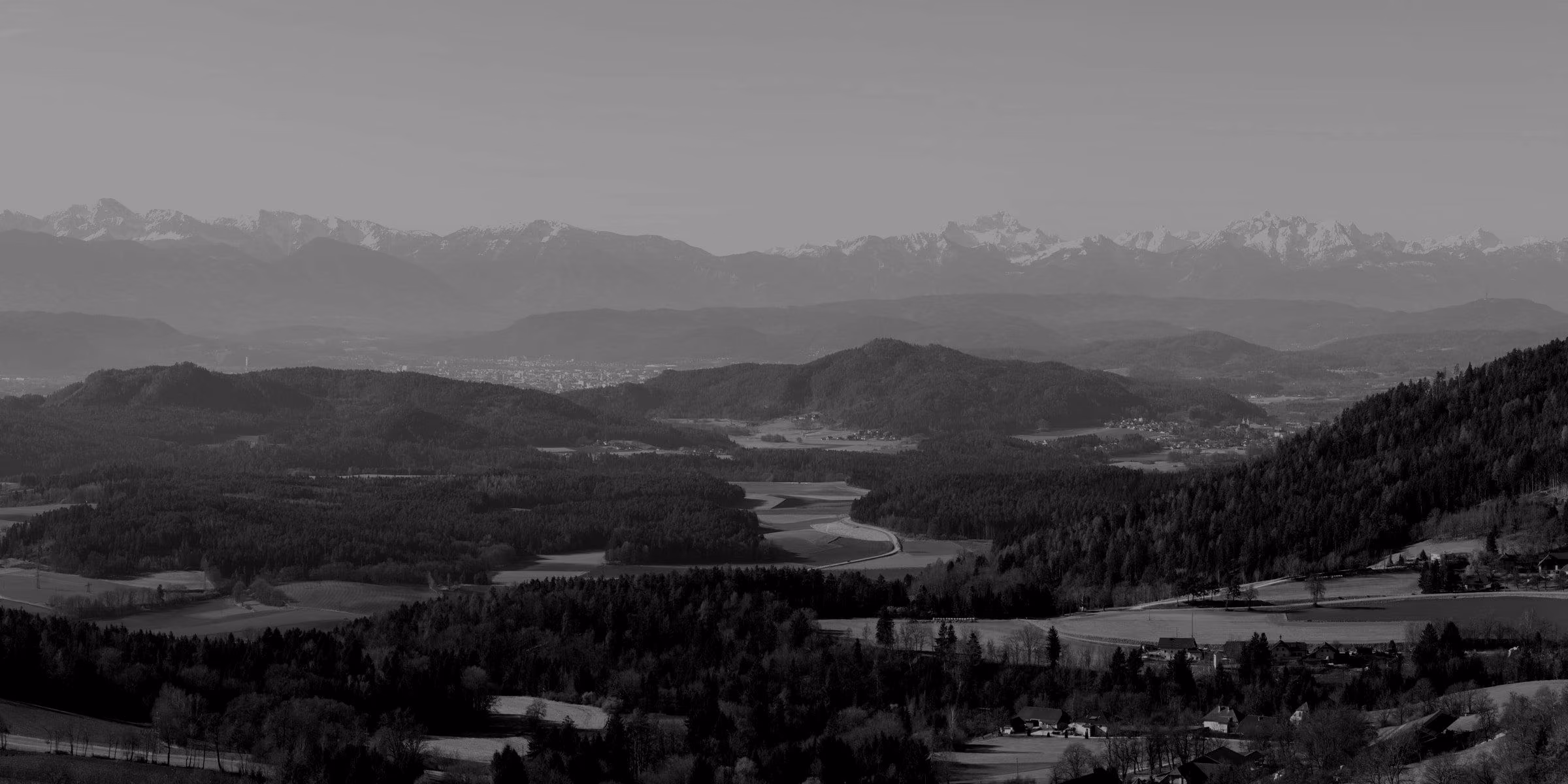 A panoramic view of the Karawanks mountains and the Klagenfurt Basin in Carinthia.