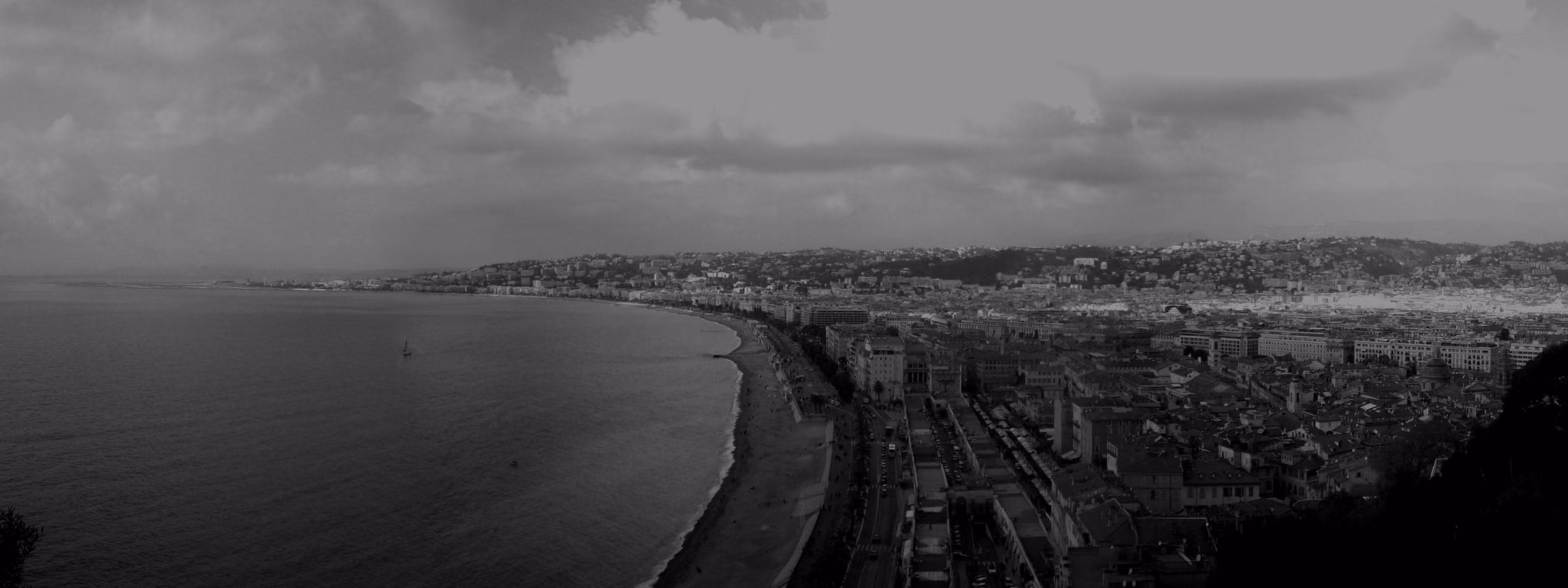 The Bay of Angels curving along the Promenade des Anglais in Nice, seen from above.